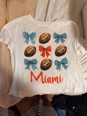 Free Kisses White Tee with Blue Bows, Red Bow & Brown Footballs